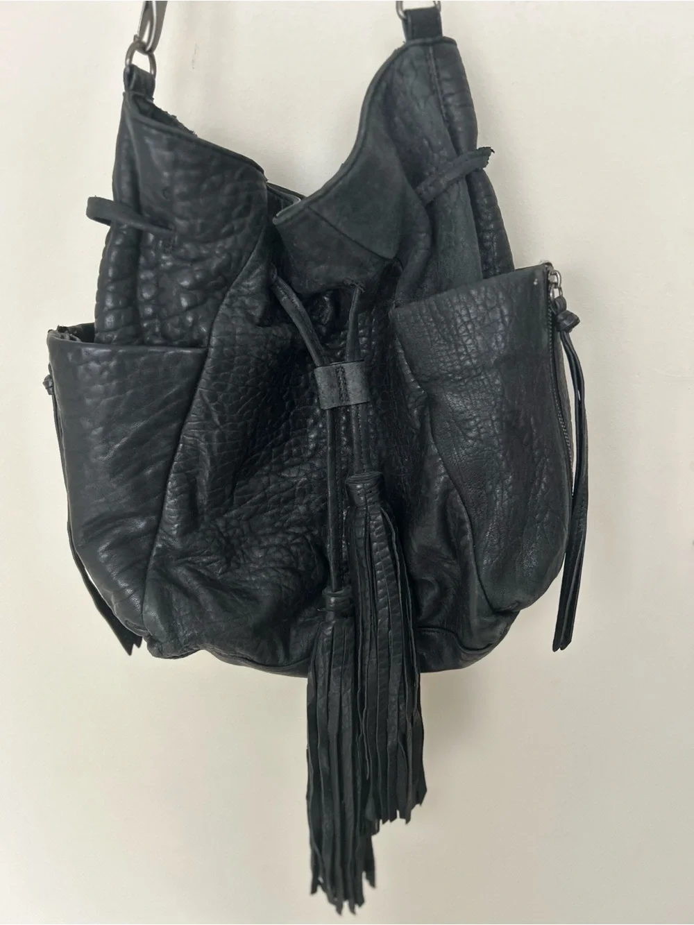 vintage Kooba hobo bag, drawstring closure, fringe tassels, exterior pockets.